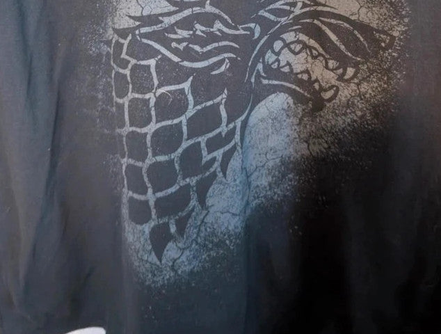 Game of Thrones black graphic tee featuring distressed House Stark direwolf sigil and logo.