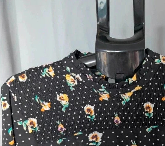 JDY black smock mini dress with floral and polka dot print, long sleeves, and keyhole back.