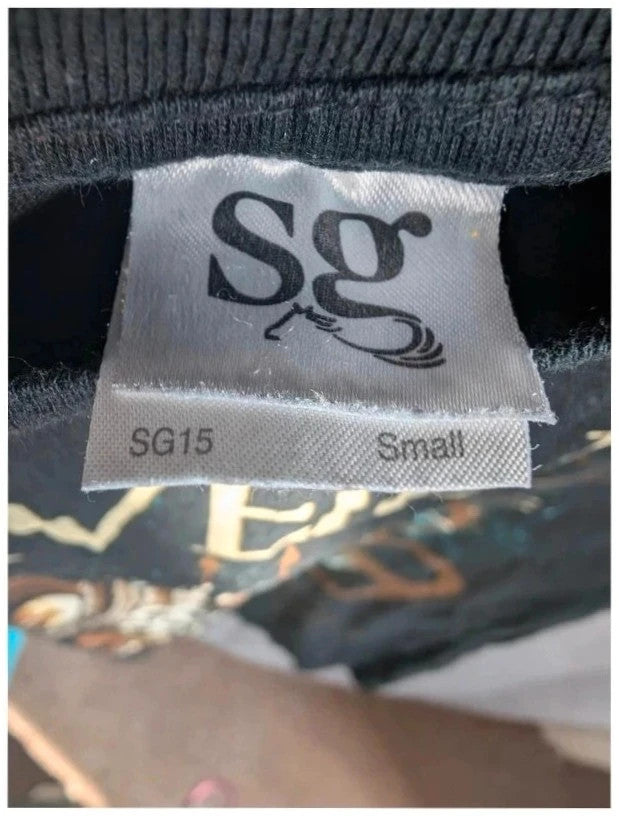 SG black graphic t-shirt featuring ornate goat skull design and distressed cream logo.