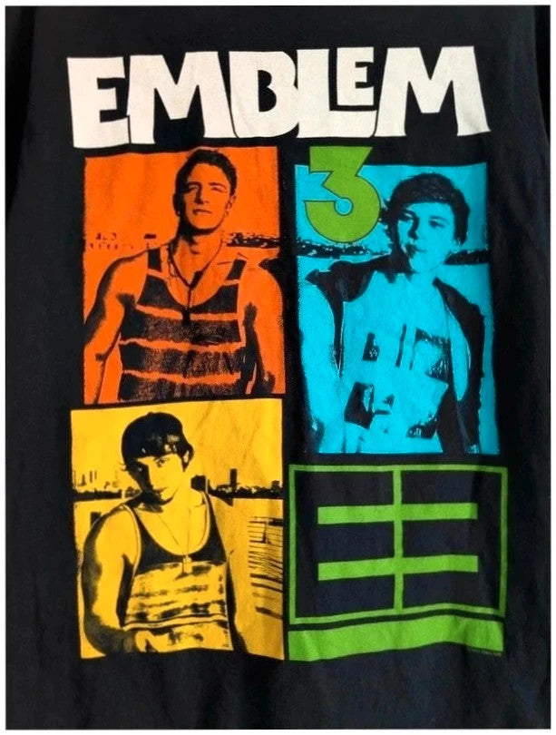 Emblem3 black graphic t-shirt with colorful four-panel print and ribbed crew neck.