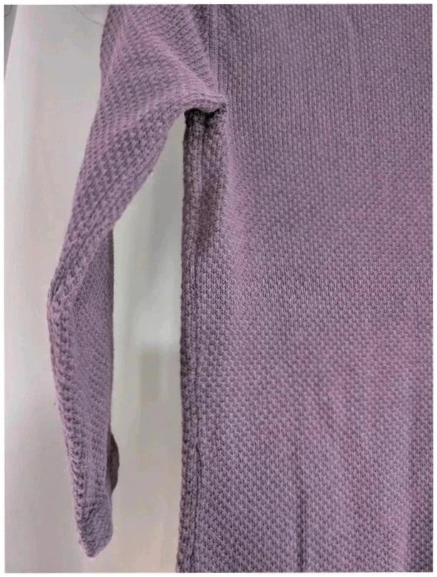 Purple knit sweater dress with long sleeves, relaxed fit, and functional front pockets.