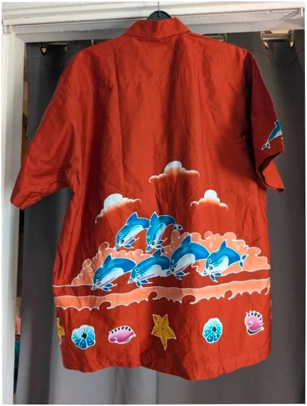 Phuket Batik burgundy graphic tee with hand-painted dolphins and commemorative embroidered pocket.