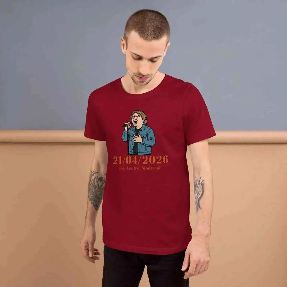 Red graphic concert T-shirt, front view with date text and microphone character