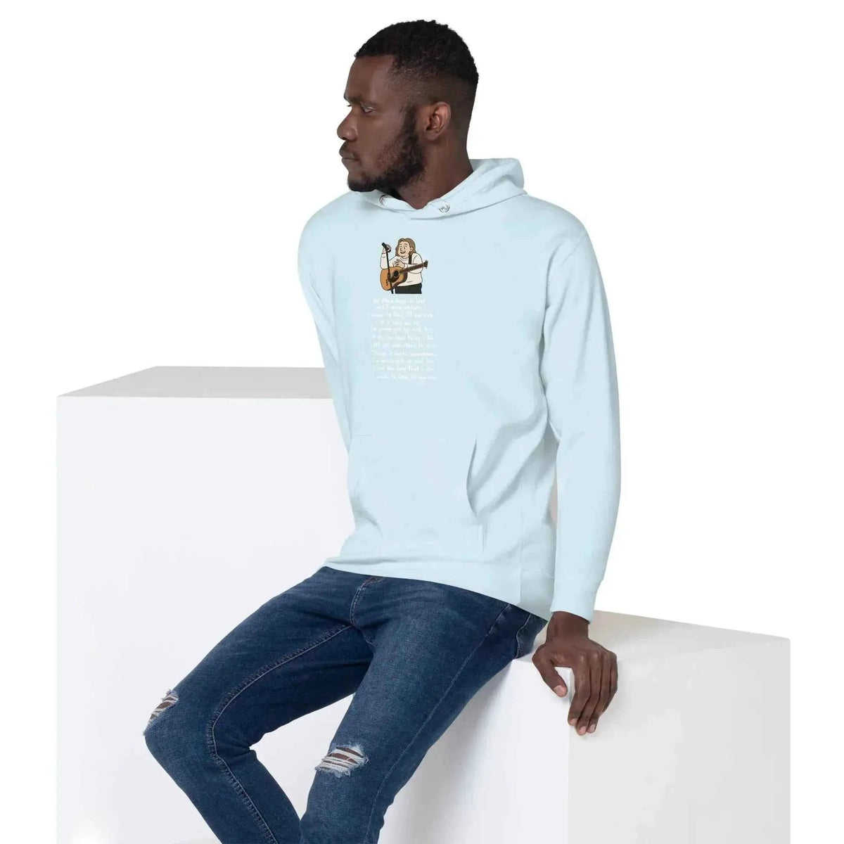 Light blue unisex pullover hoodie, side view showing front graphic print and hood.