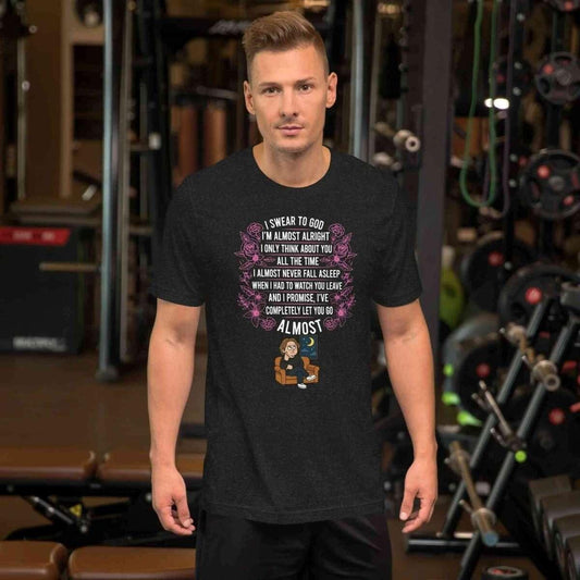 Man wearing black Lewis Capaldi Almost lyrics t-shirt with roses and cartoon character in gym setting