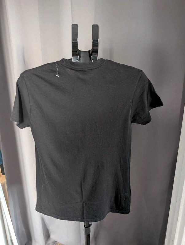The Beatles black graphic tee featuring vibrant blue and white documentary print.