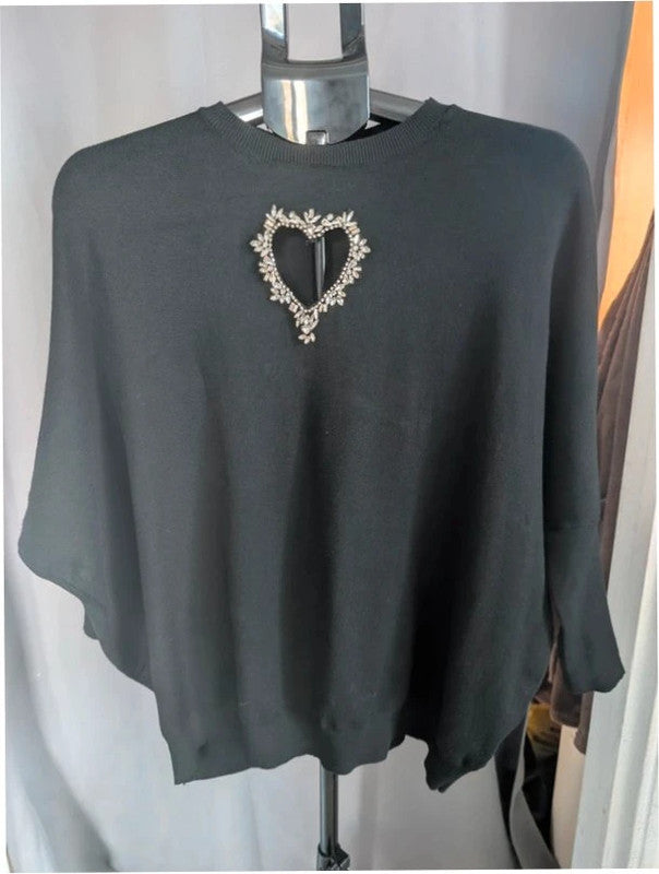 Moewy black jumper with rhinestone heart cut-out, batwing sleeves, and ribbed cuffs.