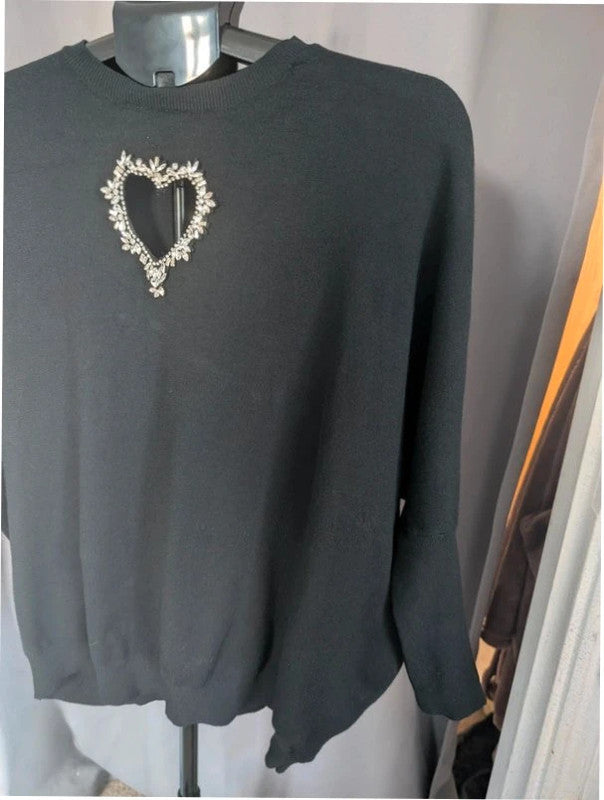 Moewy black jumper with rhinestone heart cut-out, batwing sleeves, and ribbed cuffs.
