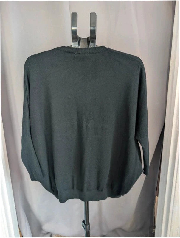 Moewy black jumper with rhinestone heart cut-out, batwing sleeves, and ribbed cuffs.