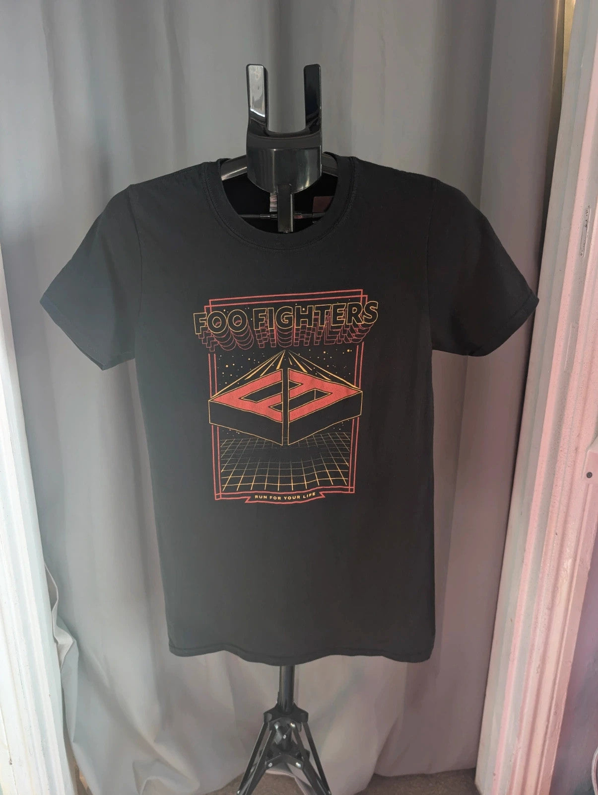 Gildan black pocket t-shirt with Foo Fighters "Run For Your Life" graphic and vibrant colors.