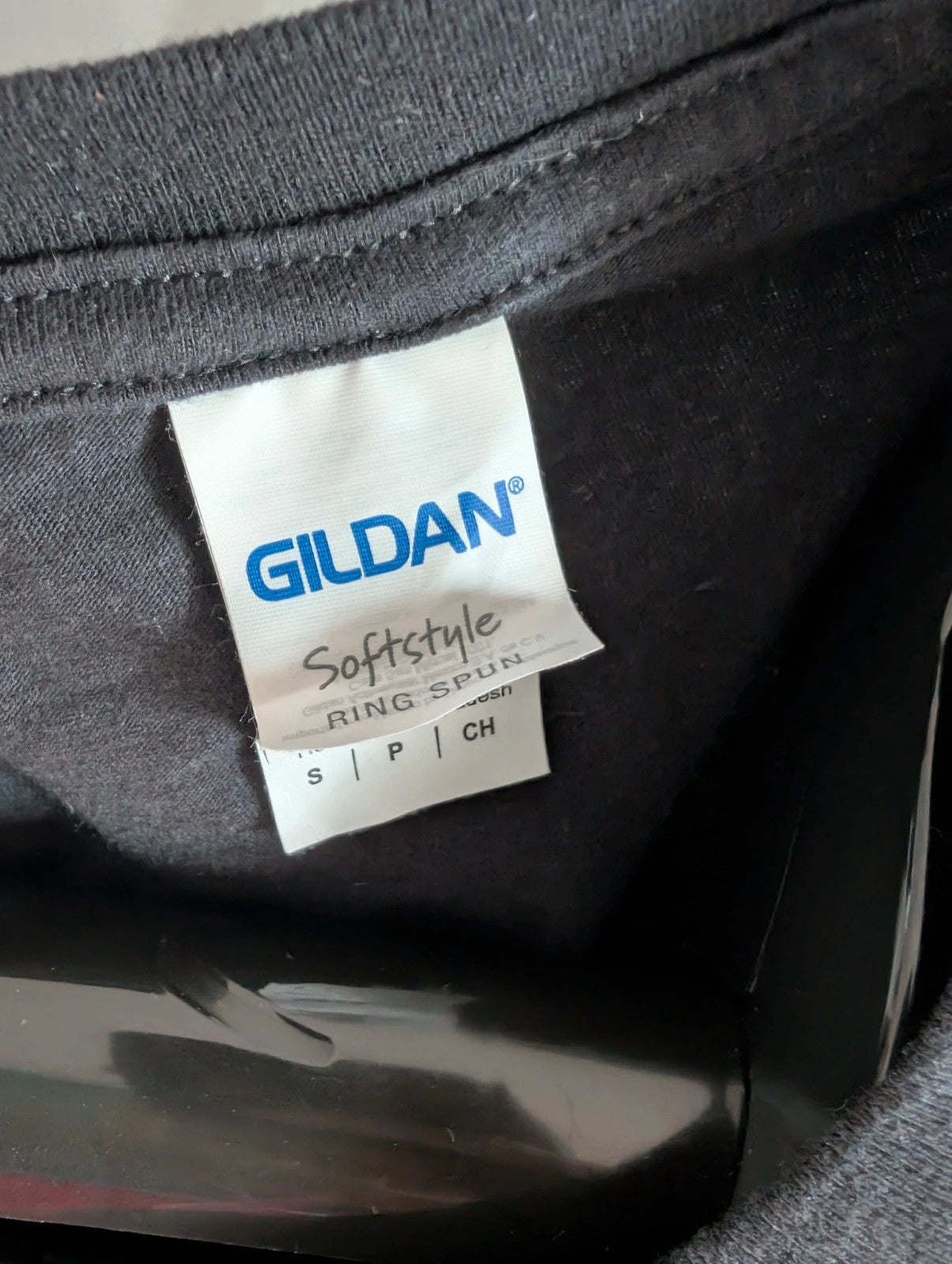 Gildan black pocket t-shirt with Foo Fighters "Run For Your Life" graphic and vibrant colors.