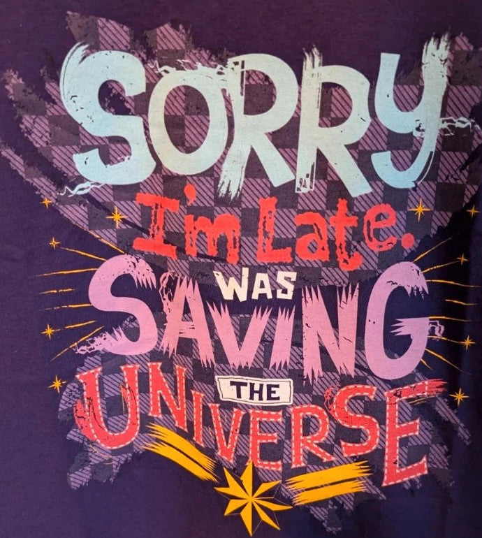 Marvel graphic t-shirt purple featuring "Sorry I'm Late" text and Captain Marvel star motif.