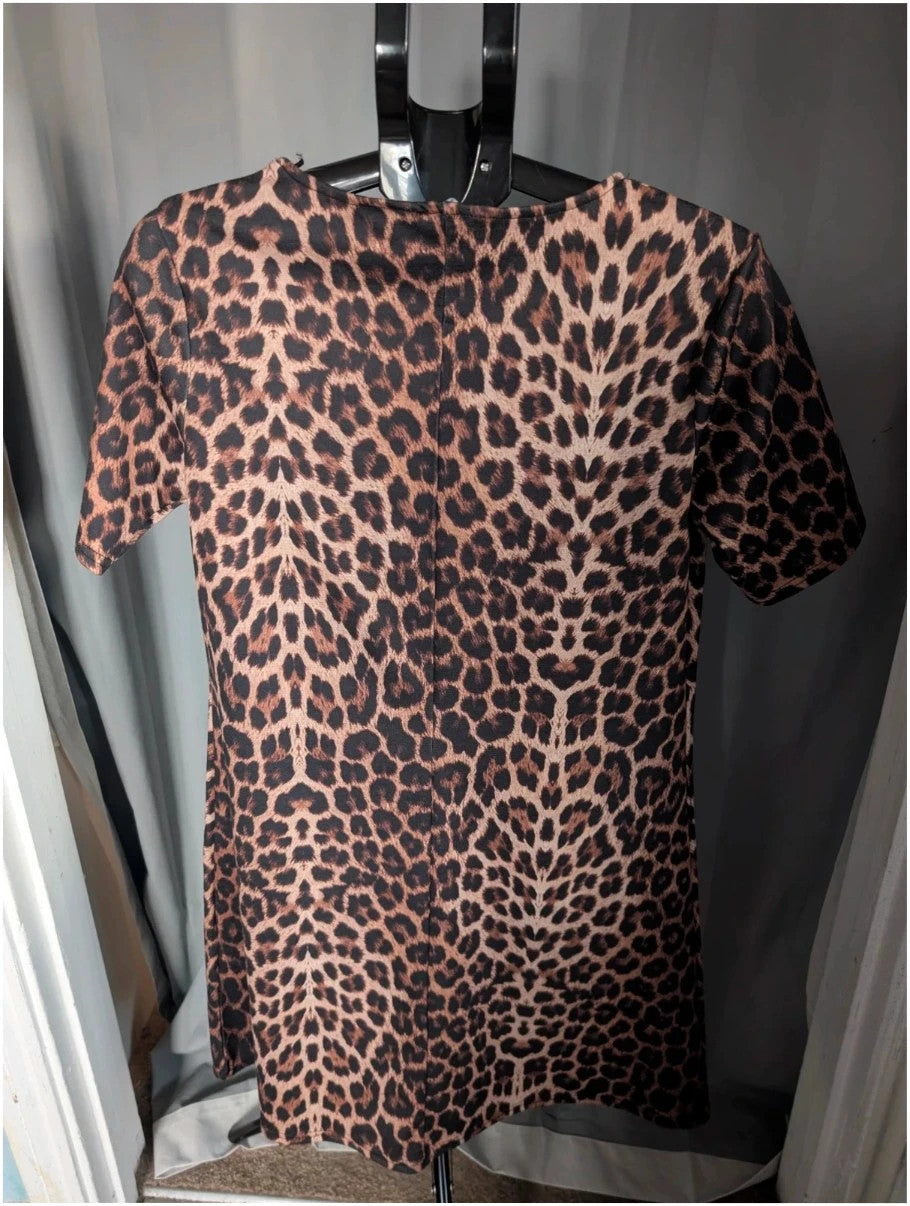 Peacocks leopard print shift mini dress in black and brown with scoop neckline and short sleeves.