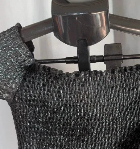 Light Before Dark black and silver smocked crop top with metallic shimmer and ruffle trims.