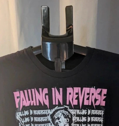 Next Level black graphic tee featuring pink Falling In Reverse logo and band portrait.