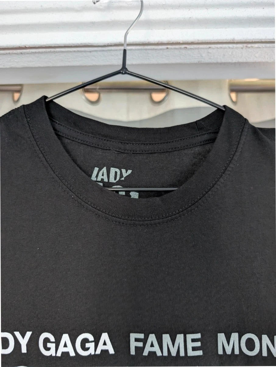 Lady Gaga black graphic t-shirt with white 'Fame Monster' print and crew neck.