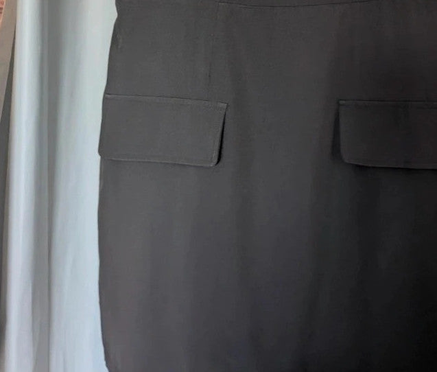 SHEIN black sleeveless mini dress with front flap pockets and back zip fastening.