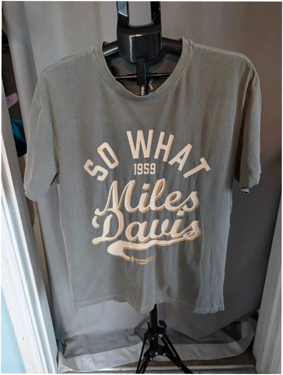 Miles Davis grey graphic tee featuring "So What 1959" typography and trumpet artwork.