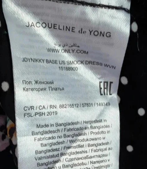 JDY black smock mini dress with floral and polka dot print, long sleeves, and keyhole back.