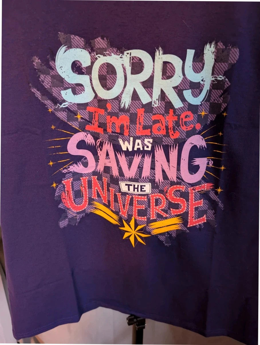 Marvel graphic t-shirt purple featuring "Sorry I'm Late" text and Captain Marvel star motif.