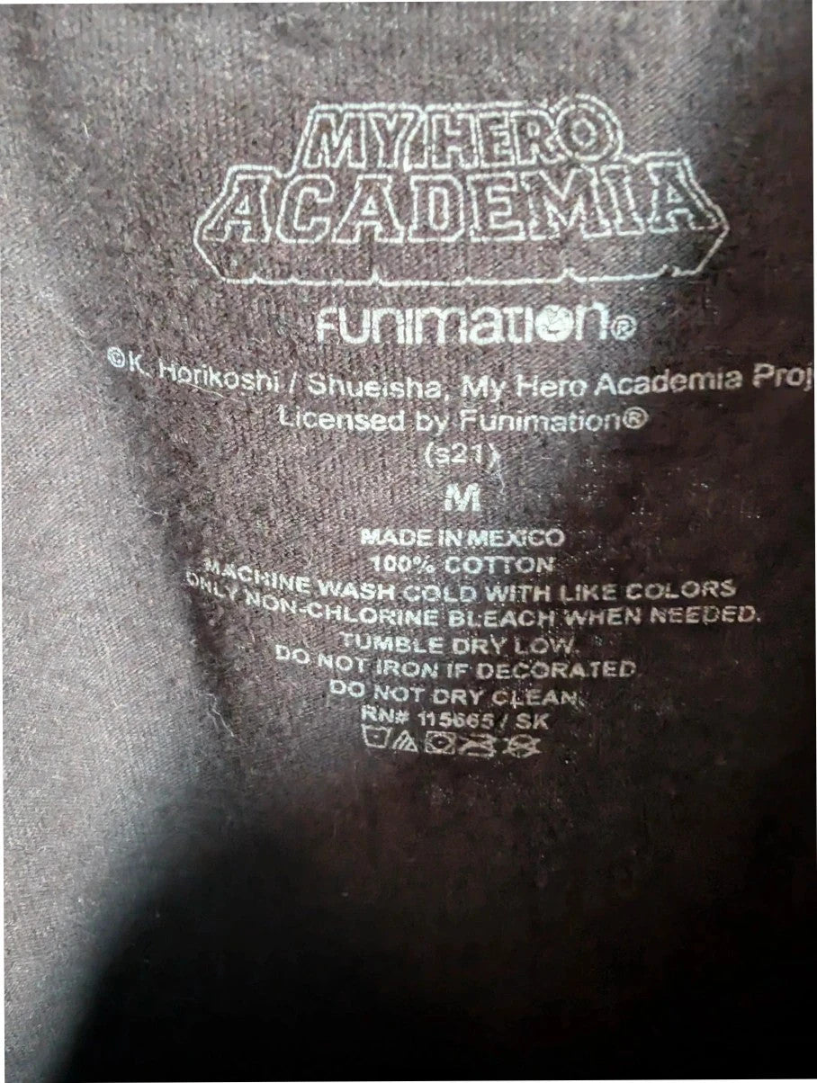 My Hero Academia black graphic tee featuring vibrant comic art panel and dual language title.