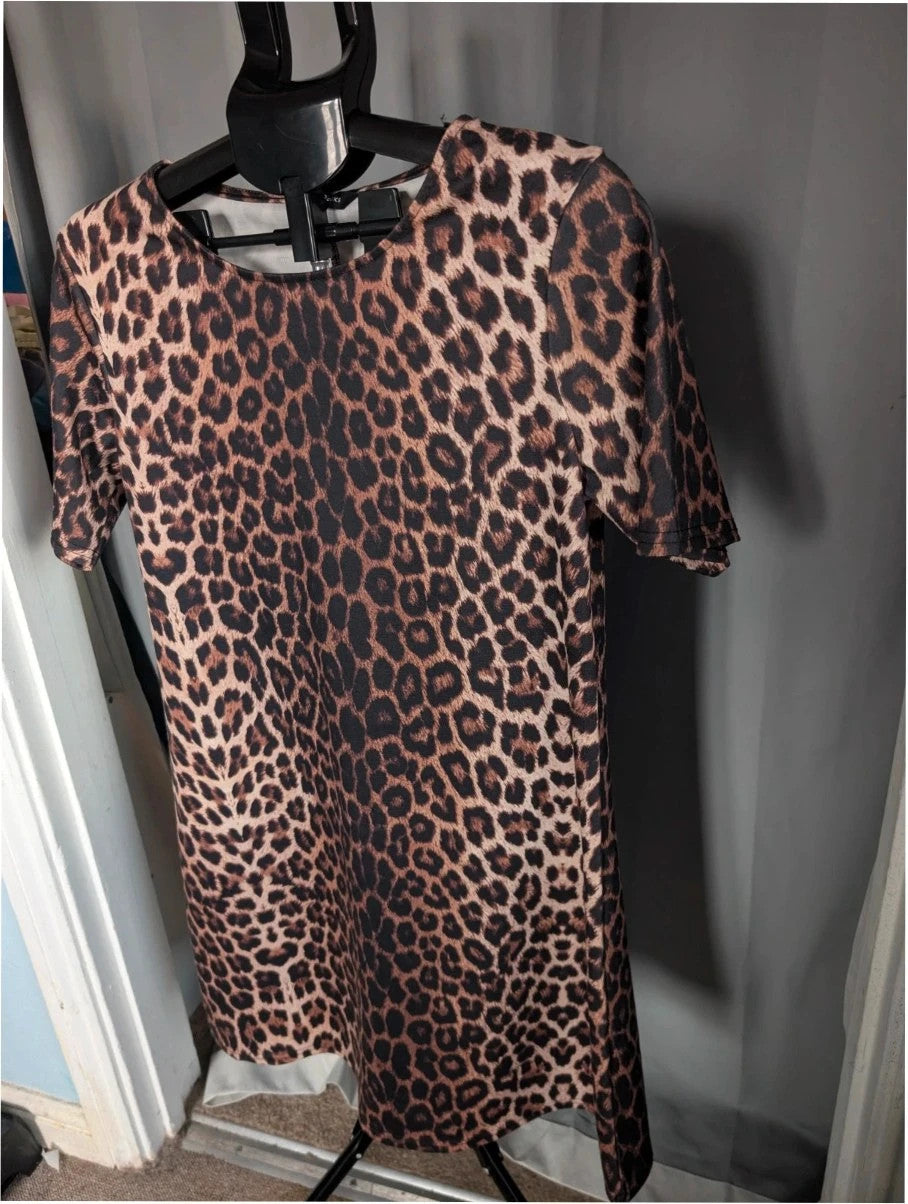 Peacocks leopard print shift mini dress in black and brown with short sleeves and scoop neckline.