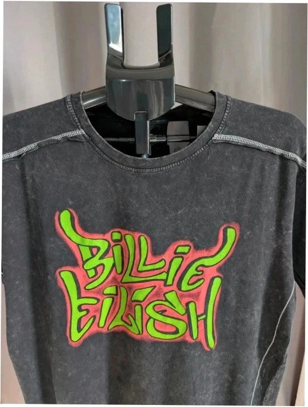Billie Eilish acid wash pocket t-shirt black with neon green and red graphic design.