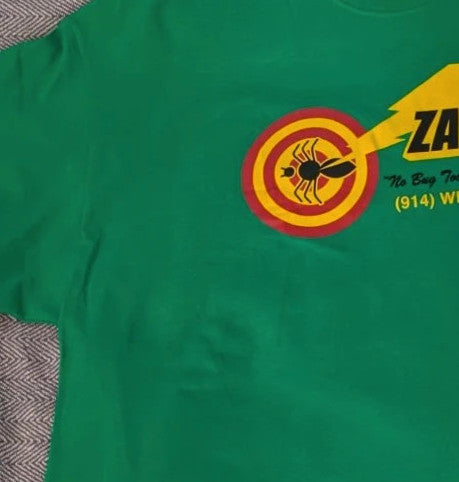 Gildan green graphic tee featuring Men In Black "Zap-Em Exterminators" logo and slogan.