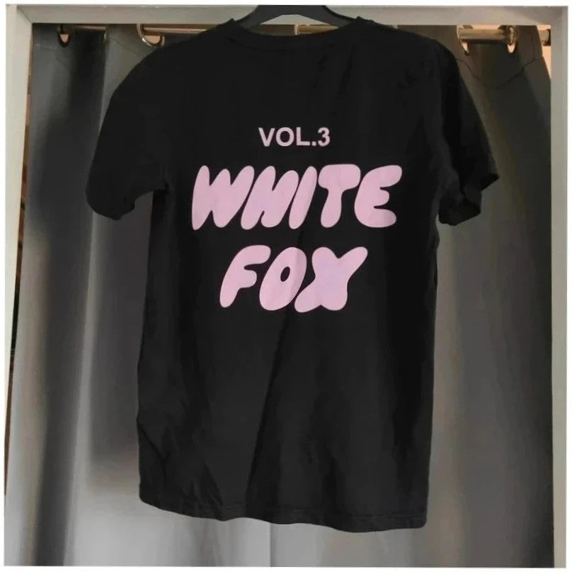 White Fox black graphic t-shirt with neon pink "Vol.3" logo and ribbed neckline.