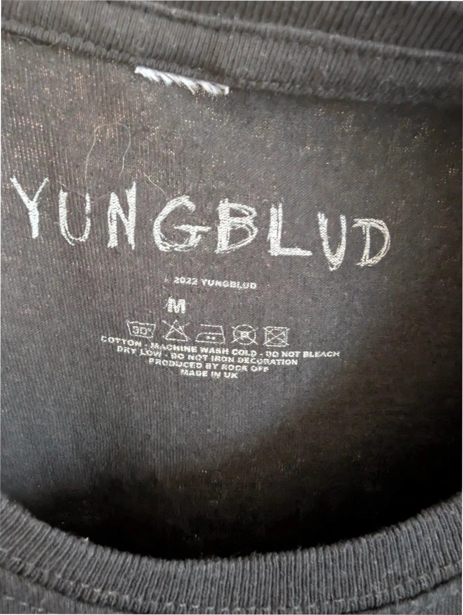 Yungblud black graphic tee with metallic silver portrait and neon pink tour lettering.