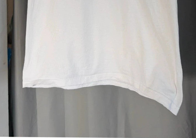 Y2K white pocket t-shirt featuring Girls Aloud band graphic and typography print.