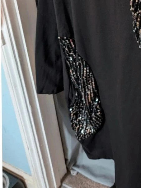 New Collection black tunic dress with silver sequin panels and relaxed crew neckline.