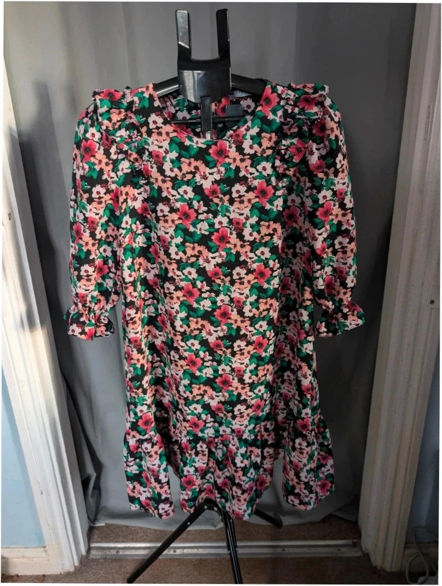 Papaya multi floral mini dress with ruffle shoulders, tiered hem, and keyhole back.