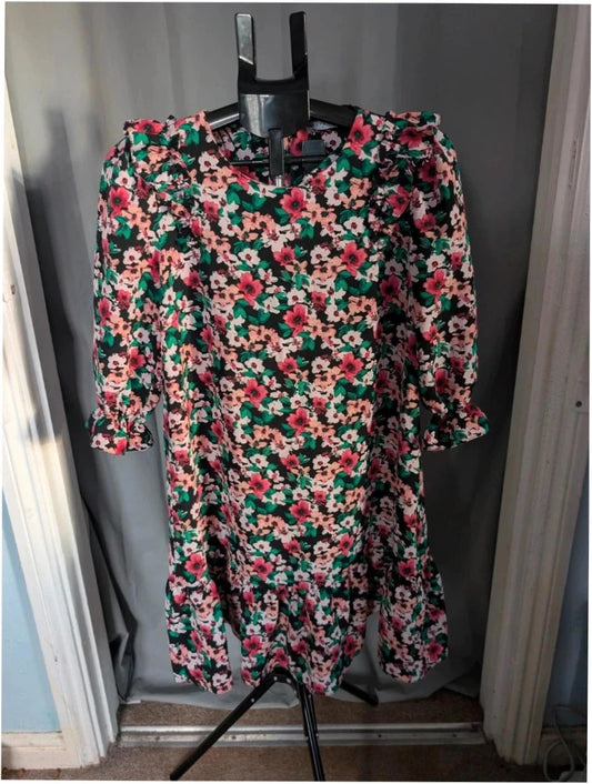 Papaya multi floral mini dress with ruffle shoulders, tiered hem, and keyhole back.