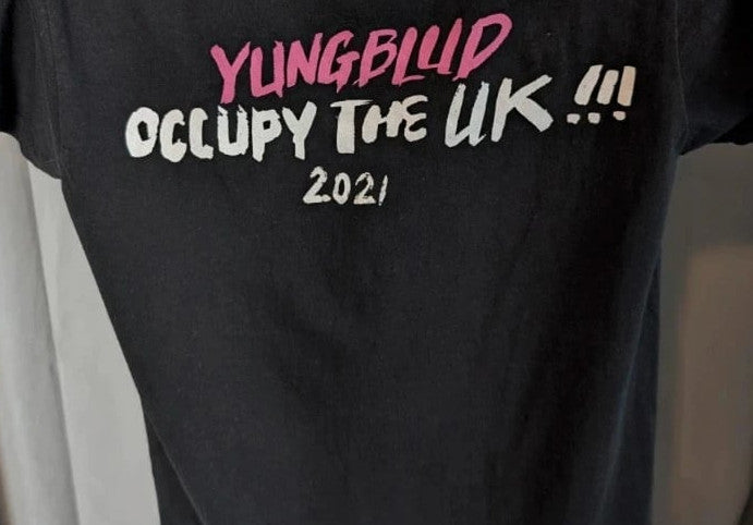Yungblud black graphic tee with metallic silver portrait and neon pink tour lettering.