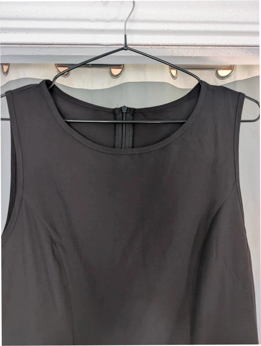SHEIN black sleeveless mini dress with front flap pockets and back zip fastening.