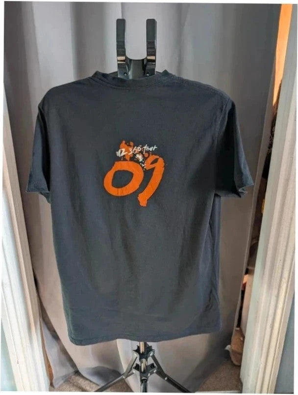 edun live black graphic t-shirt with vibrant orange U2 360 Tour prints front and back
