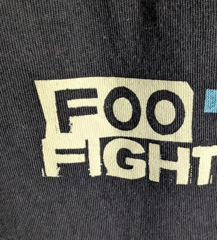 Foo Fighters black graphic tee with coiling snake and checkerboard pattern, soft cotton.