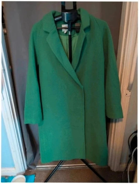 H&M green longline coat with structured shoulders and notch lapel collar.