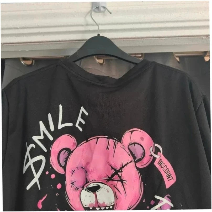 Unbranded black graphic t-shirt with neon pink teddy bear and bold text design.