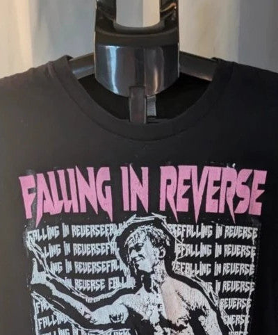Next Level black graphic tee featuring pink Falling In Reverse logo and band portrait.