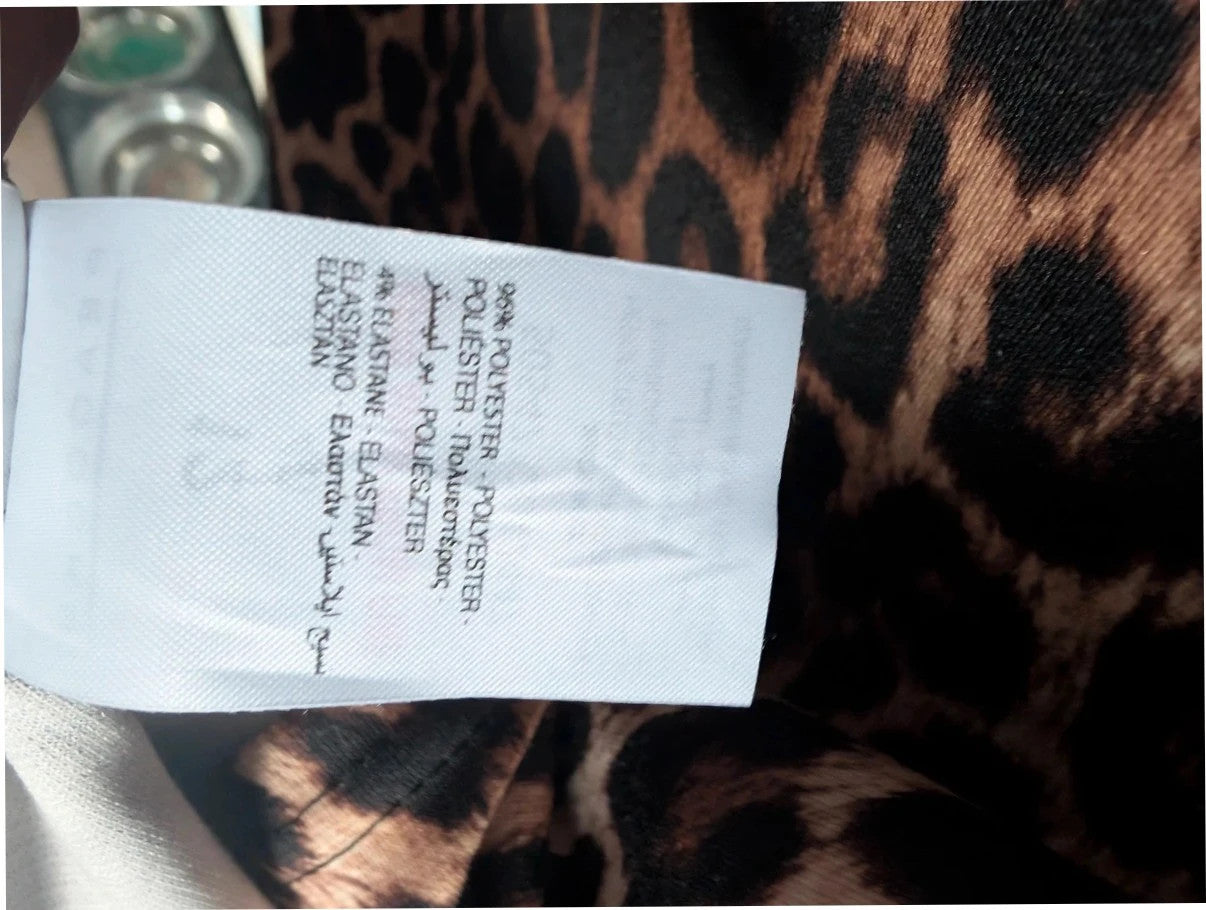 Peacocks leopard print shift mini dress in black and brown with scoop neckline and short sleeves.