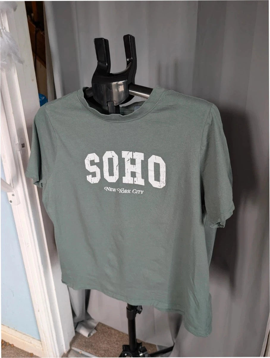 Primark green graphic t-shirt with distressed "SOHO New York City" print and ribbed neckline.