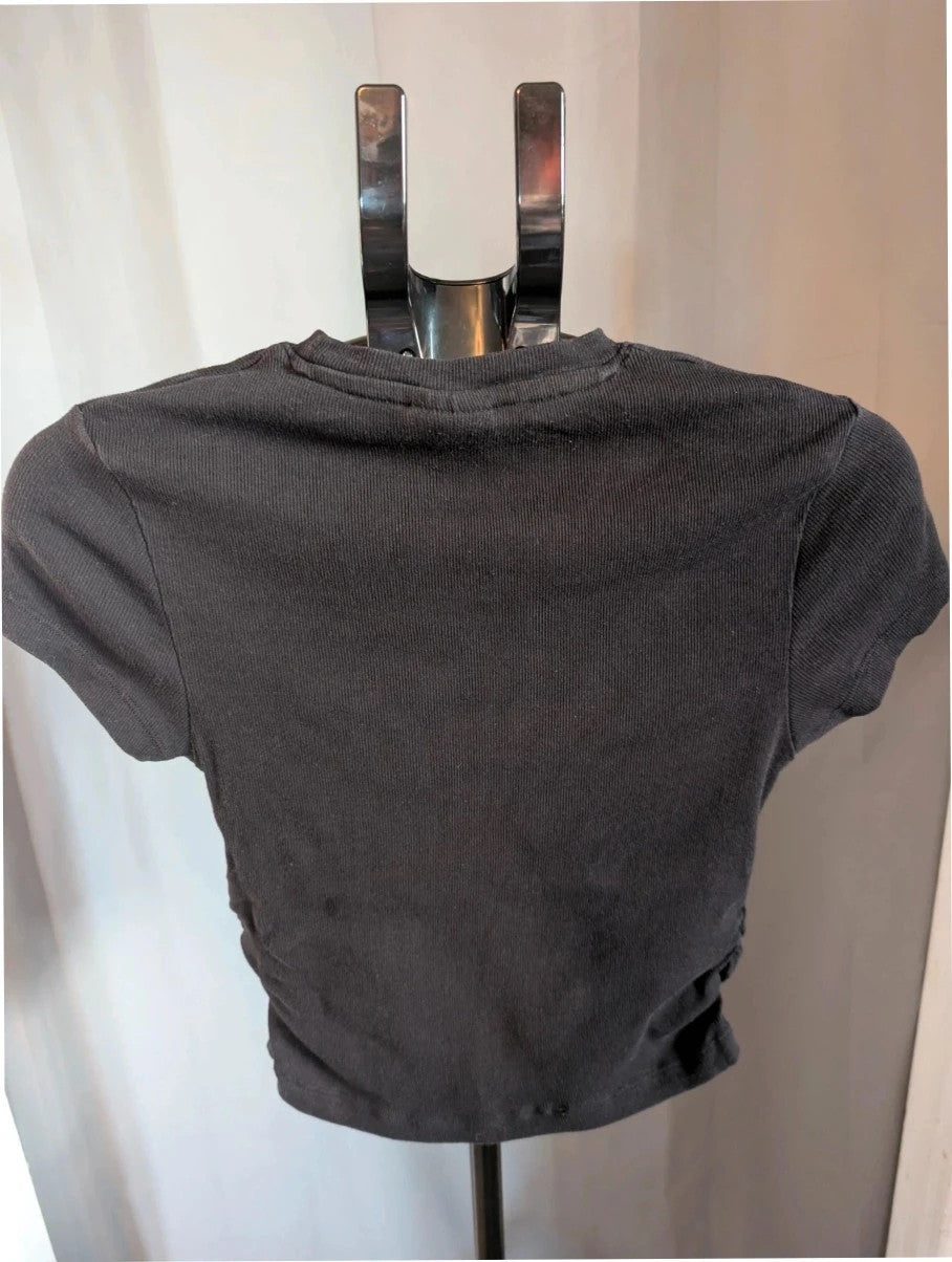 Primark black crop top featuring Tupac portrait graphic and ruched side detailing.