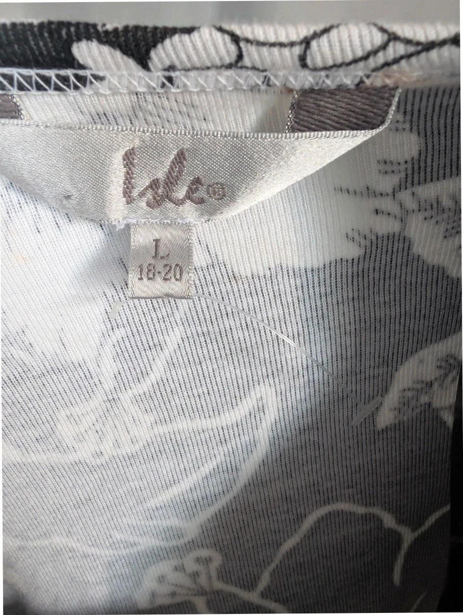 ISLE black white floral graphic t-shirt with rhinestone accents and hibiscus pattern.