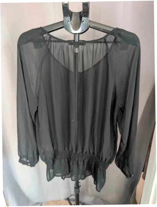 Next black sheer long sleeve blouse with tie neck and ruffle hem detail.