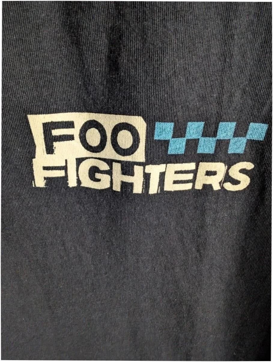 Foo Fighters black graphic tee featuring coiling snake design and blue checkerboard pattern.