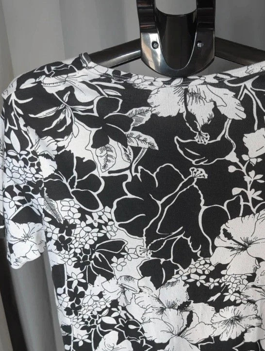 ISLE black white floral graphic t-shirt with rhinestone accents and hibiscus pattern.