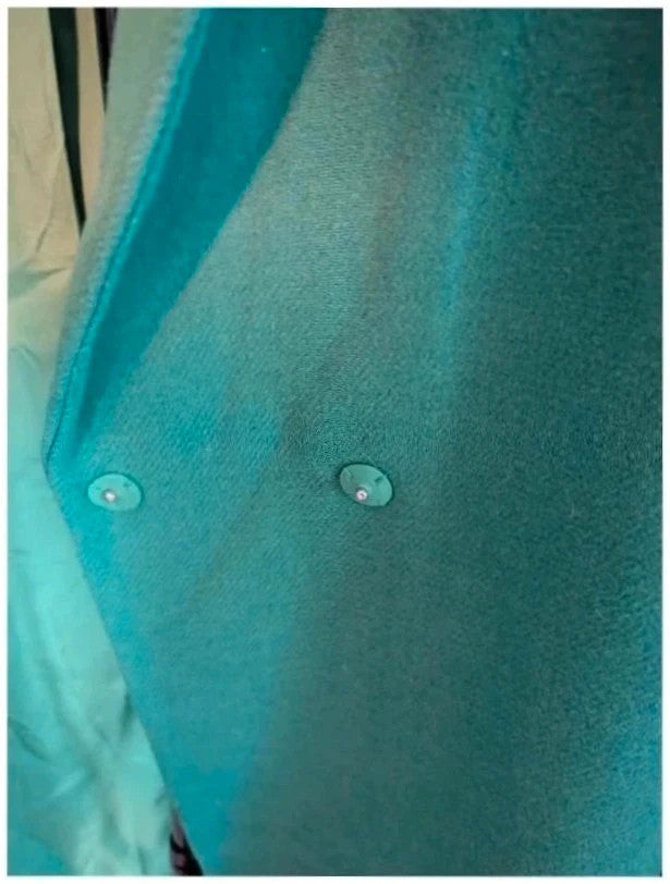 H&M green longline coat with structured shoulders and notch lapel collar.