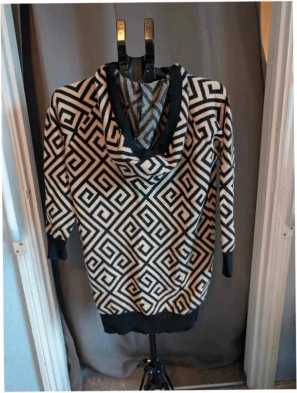 Moewy black cream geometric knit hooded jumper dress with drawstring hood and ribbed cuffs.